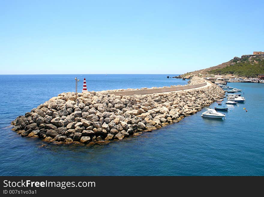 Water-break of Mgarr port on Gozo island, Malta. Water-break of Mgarr port on Gozo island, Malta