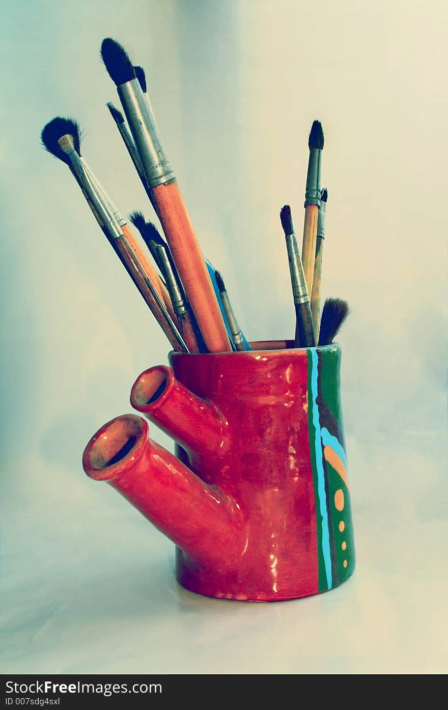 Art brushes in handmade vase