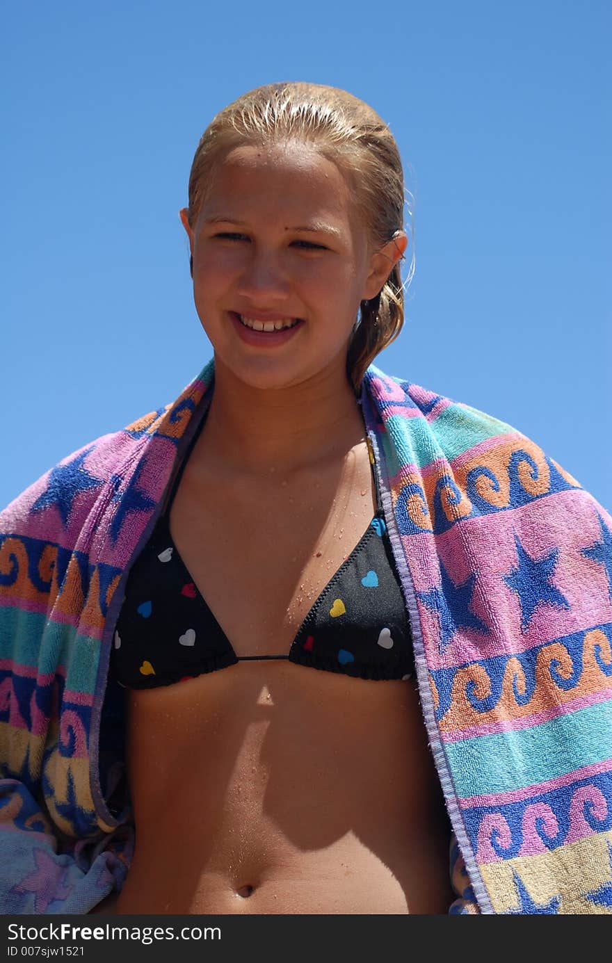 A teenager girl wet after the ocean. A teenager girl wet after the ocean