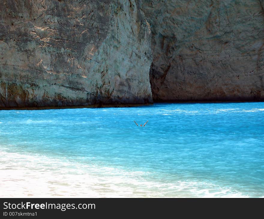 Fabulous beach with turquoise waters and woman waving and having fun - you can almost taste the surf!. Fabulous beach with turquoise waters and woman waving and having fun - you can almost taste the surf!