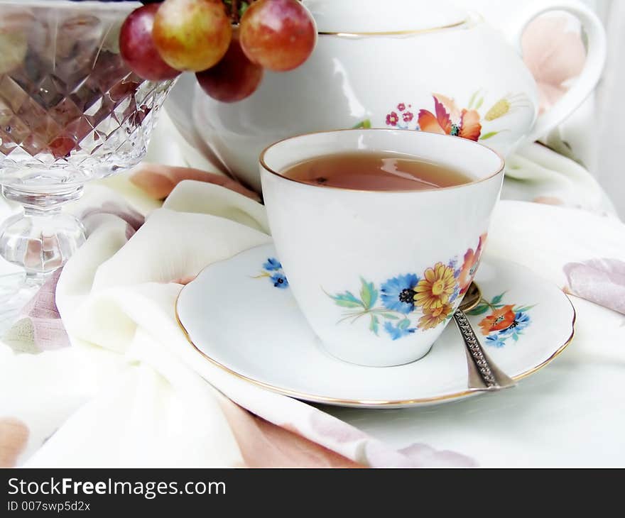 Still life with cup of tea and fruits