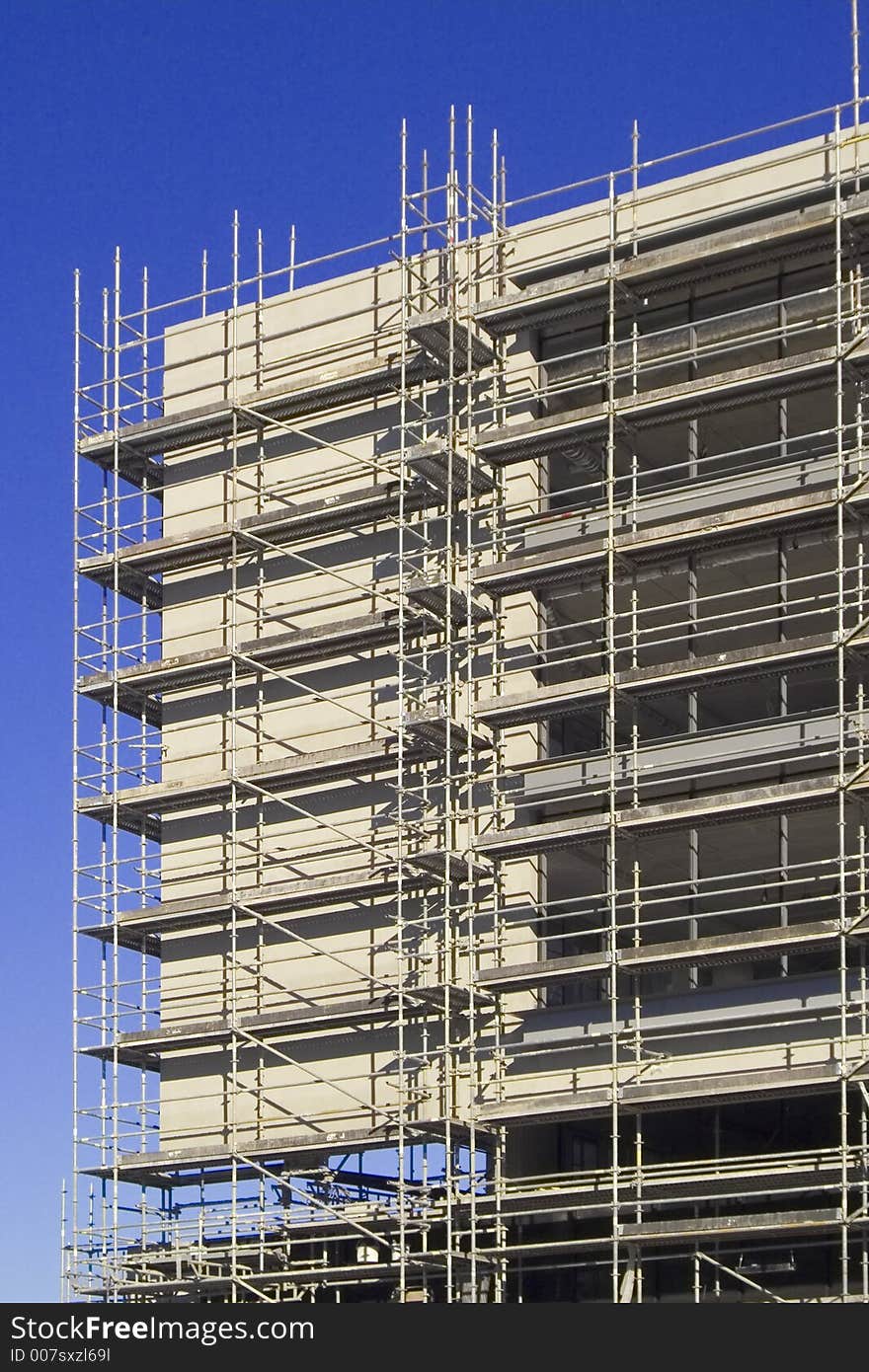 Building under construction structure with a blue sky