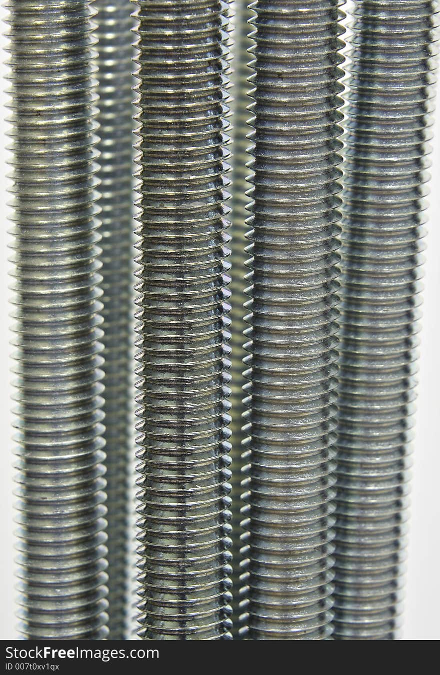 An image of several sticks of threaded rod