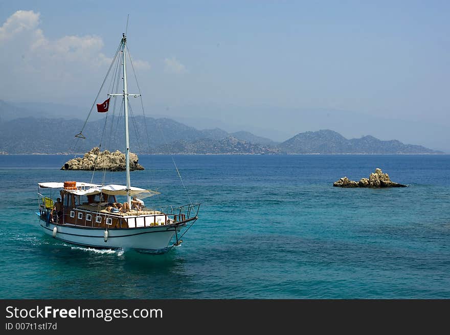 Cruise Ship between rocks