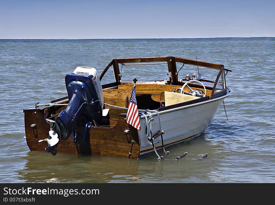 A 1963 Henry outboard with Evenrude motor, anchored off shore of Lake Erie, Cleveland Ohio. A 1963 Henry outboard with Evenrude motor, anchored off shore of Lake Erie, Cleveland Ohio.