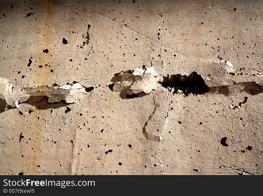 Concrete wall with big cracks