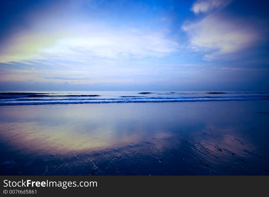 Beautiful blue sunset reflections on the beach. Beautiful blue sunset reflections on the beach