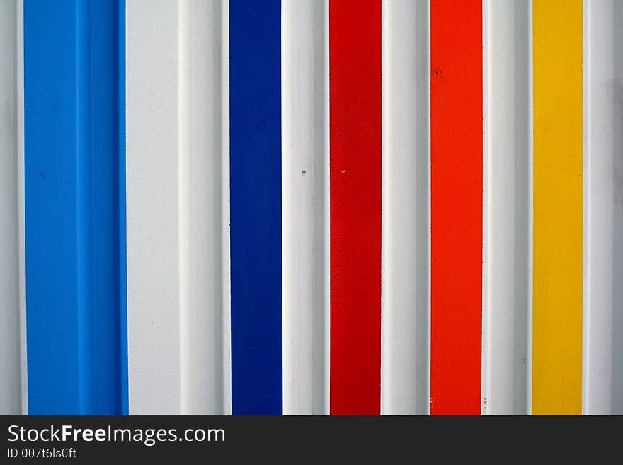 A metal wall with colours. A metal wall with colours