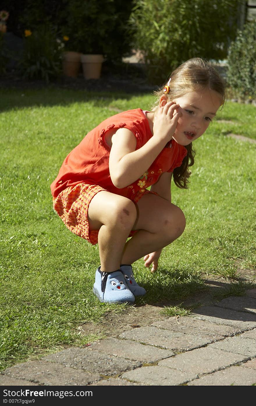 Young girl sitting on green gras. Young girl sitting on green gras