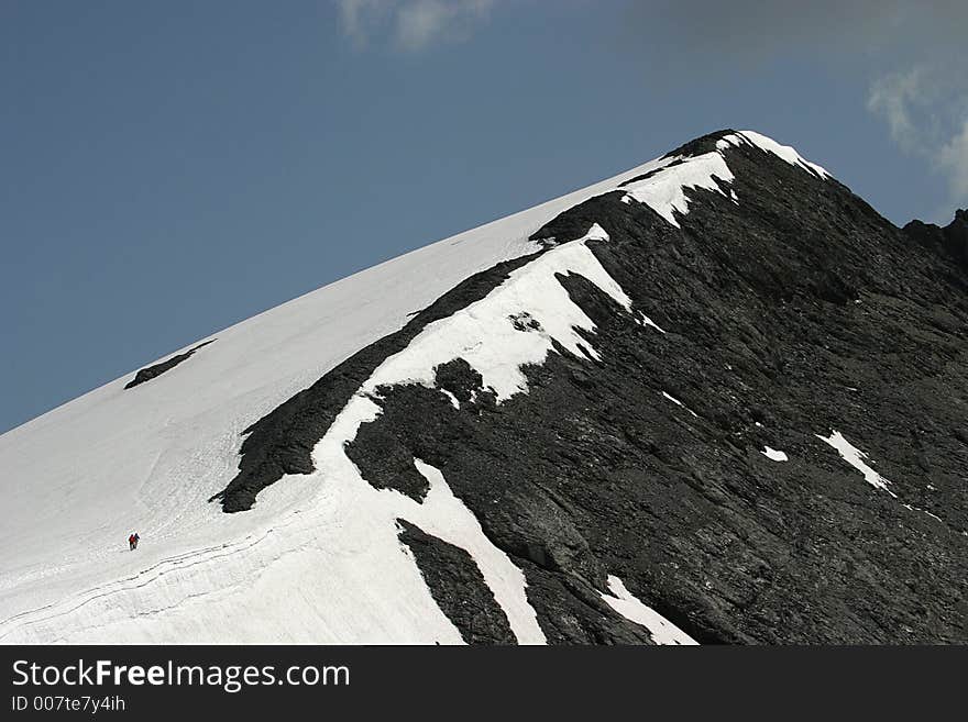 Engelberg-Titlis (3020 m), a world of high rising mount tops and enormous powder- and deepsnow descents. Two walkers are going to the top. Engelberg-Titlis (3020 m), a world of high rising mount tops and enormous powder- and deepsnow descents. Two walkers are going to the top.