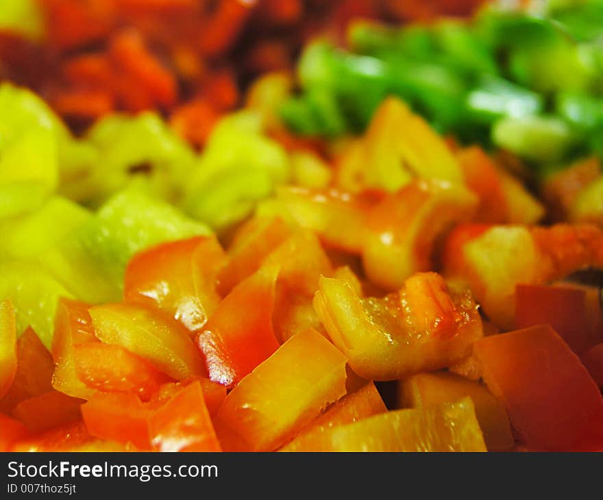 Four colors slice of paprika. Orange slices in front of view. Focus to the foreground. Four colors slice of paprika. Orange slices in front of view. Focus to the foreground