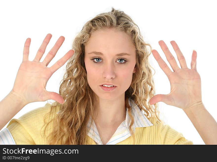 Portrait of a glamorous blonde woman holding her hands up to frame her face. Shot with a Canon 20D. Portrait of a glamorous blonde woman holding her hands up to frame her face. Shot with a Canon 20D.