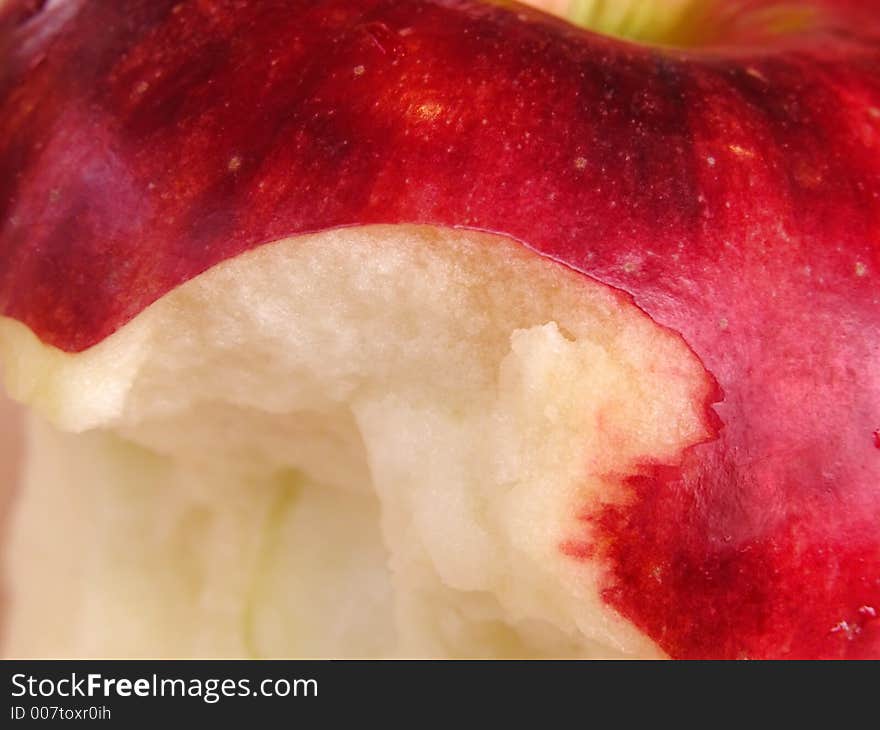 Extreme close-up of an apple with a bite missing