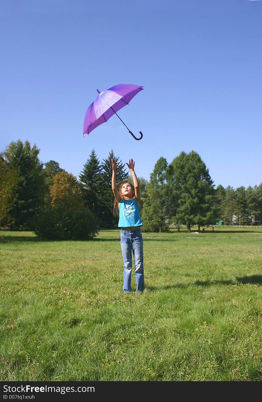 The girl playing with a umbrella