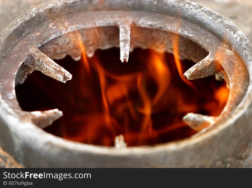 The image of fire in a metal washer