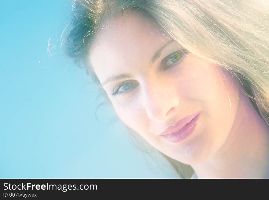 Beautiful caucasian woman smiles confident in the clear sunlight. Beautiful caucasian woman smiles confident in the clear sunlight