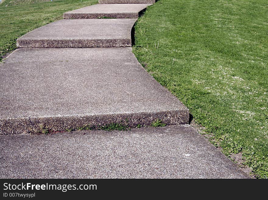 Cobblestone Footpath Curve With Stairs On Grass