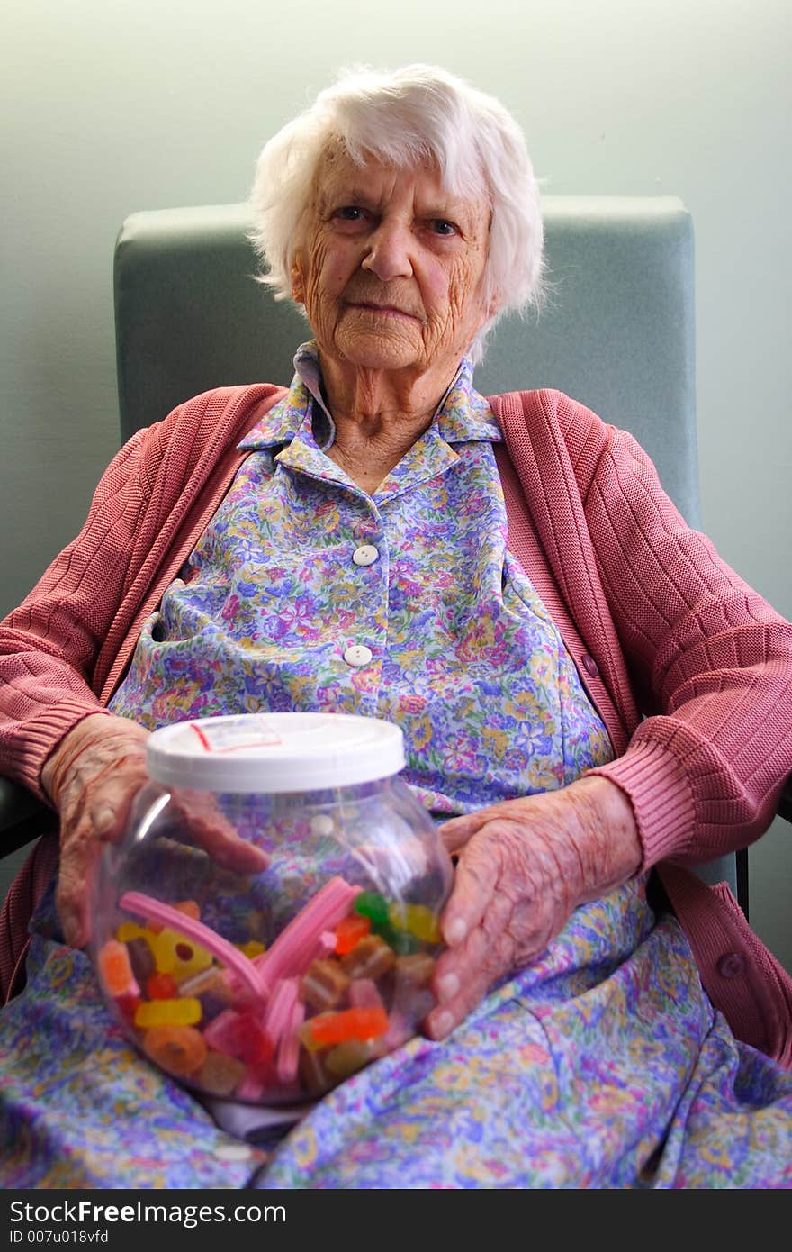 Beautiful 93yr old Senior citizen holding jar of lollies