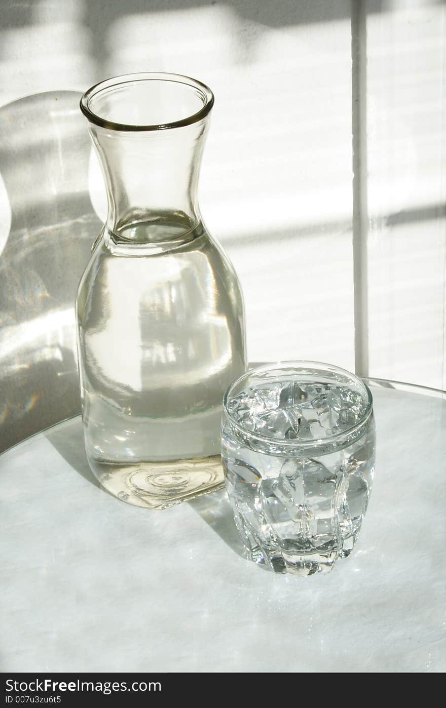 Closeup of a glass of water and bottle. Closeup of a glass of water and bottle