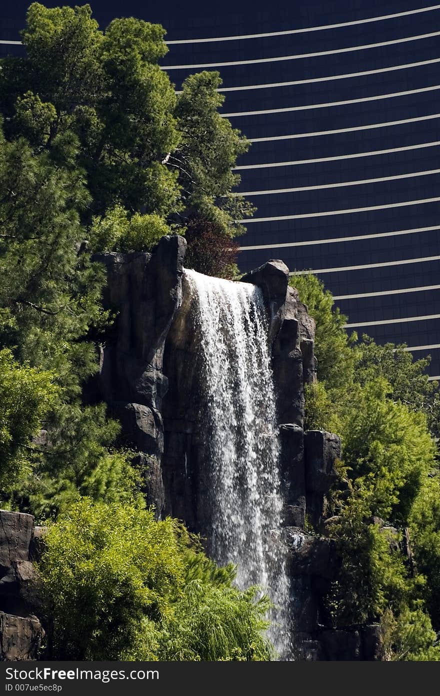 Waterfall with foliage and abstract background