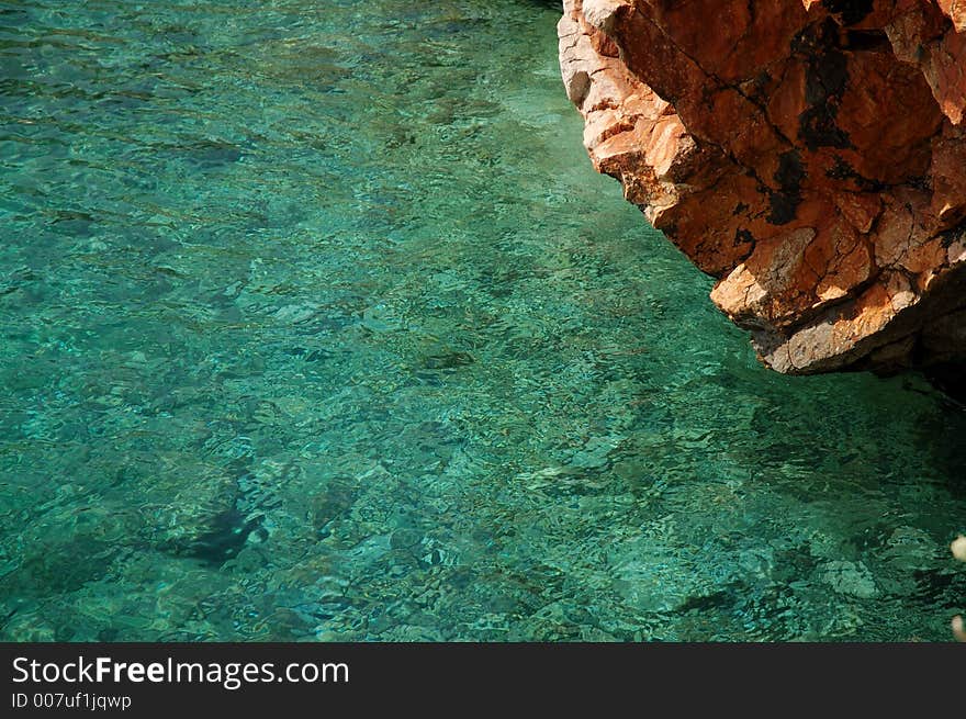 Pure sea water and a rock