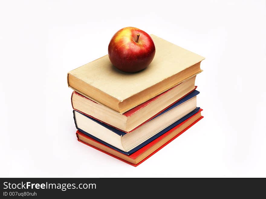 Pile of books with apple on top. Pile of books with apple on top