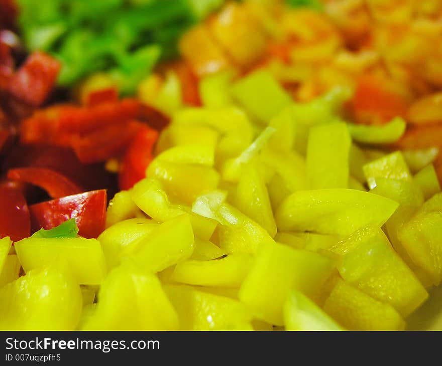 Four colors slice of paprika. Yellow slices in front of view. Four colors slice of paprika. Yellow slices in front of view