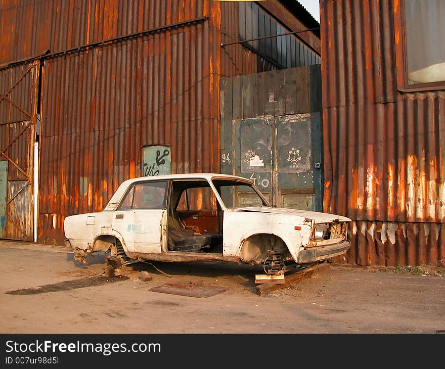 This old car, rusted through, waits for someone to pick it up. This old car, rusted through, waits for someone to pick it up...