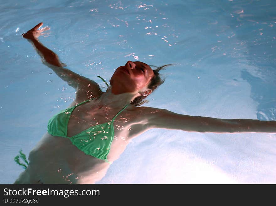 A Bikini Girl relaxing on the water. A Bikini Girl relaxing on the water