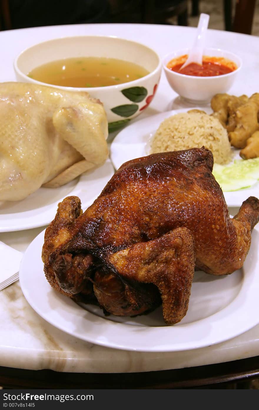 Hainanese chicken rice with roasted and steamed whole chicken