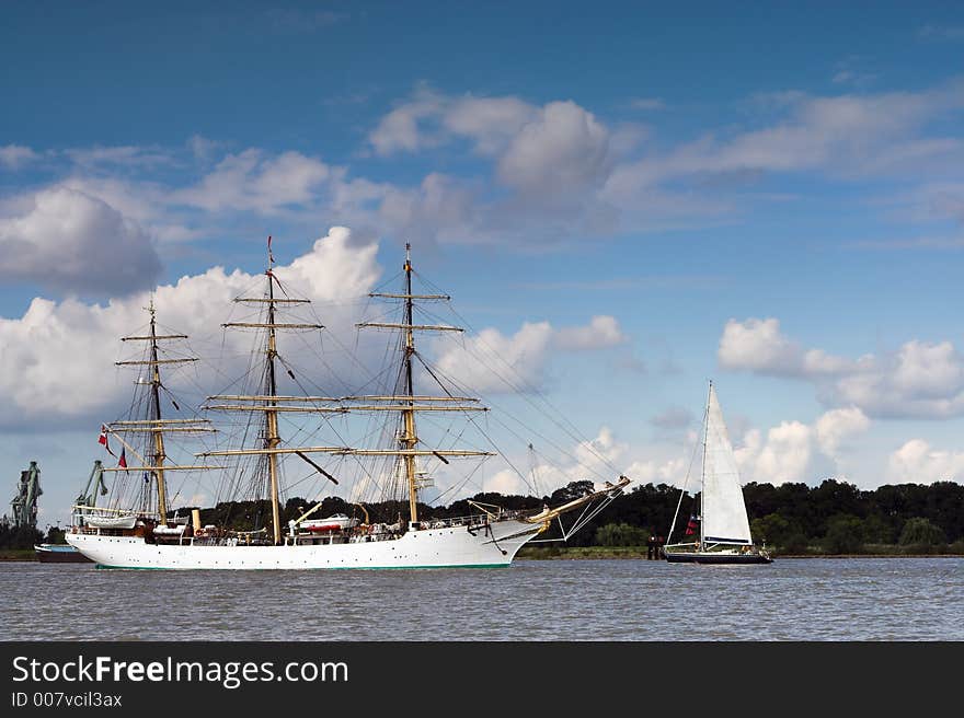 Three-masted ancient ship on parade on the river Scheldt during the 50th Tall Ships Race in Antwerp, 2006. Three-masted ancient ship on parade on the river Scheldt during the 50th Tall Ships Race in Antwerp, 2006