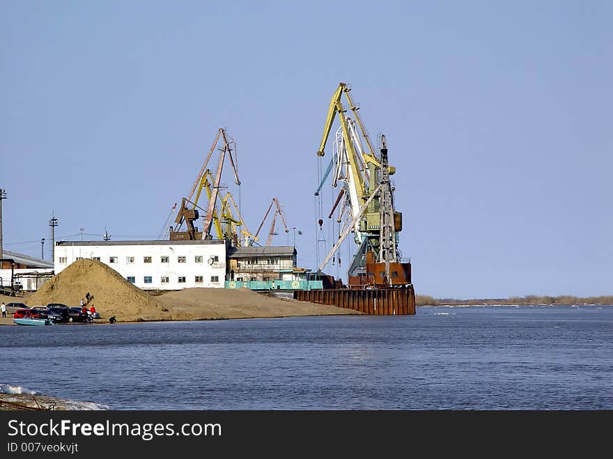 Cranes and buildings of marine port. Cranes and buildings of marine port