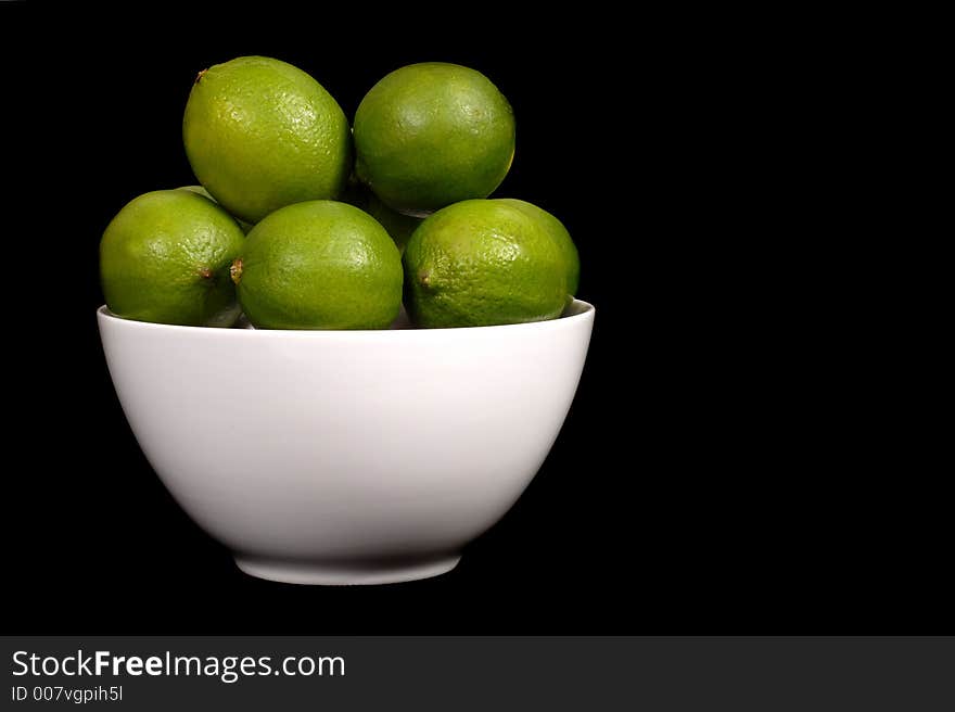 Limes in white bowl