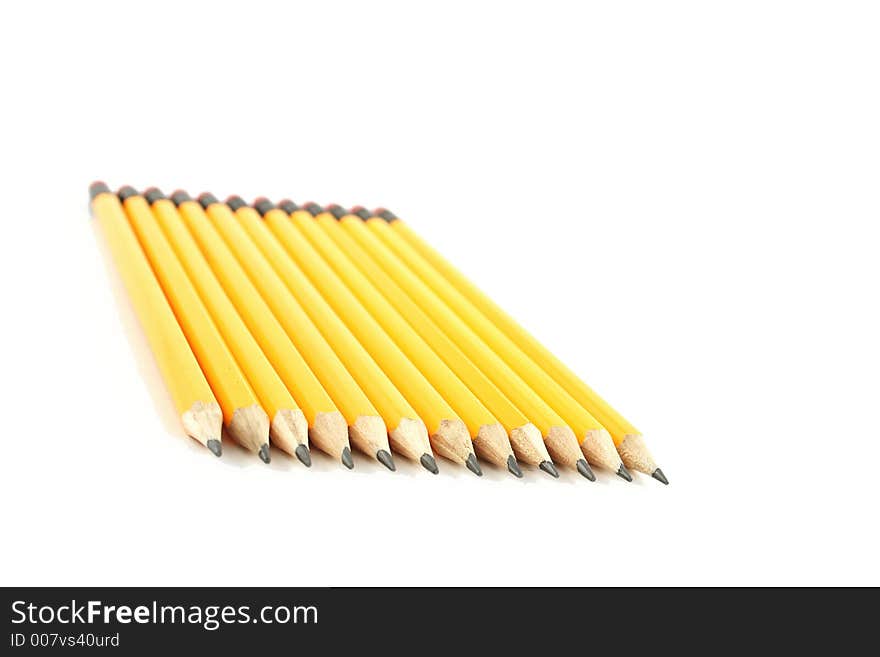 Yellow pencils on a white background