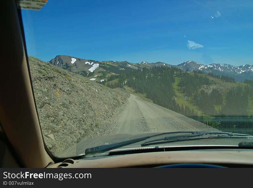 Dirt and gravel road high in the mountains of Olympic National Park in Washington State. Dirt and gravel road high in the mountains of Olympic National Park in Washington State