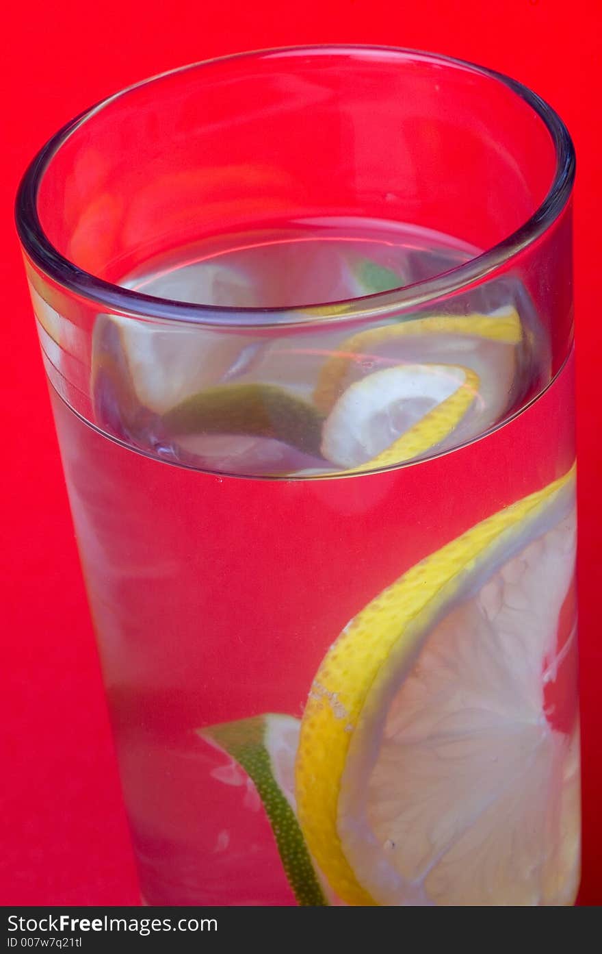 Close up of glass with drink and lemon. Close up of glass with drink and lemon