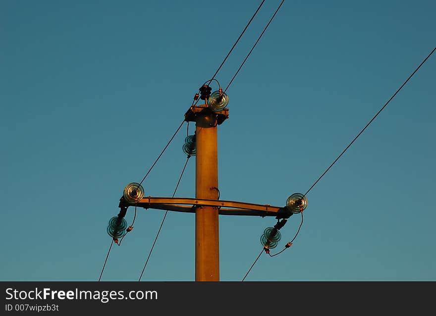 Power line and a blue sky in a background