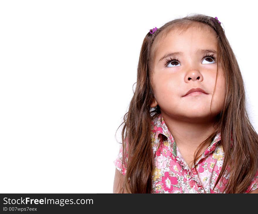 Cute young girl becoming irritated by the camera. Cute young girl becoming irritated by the camera