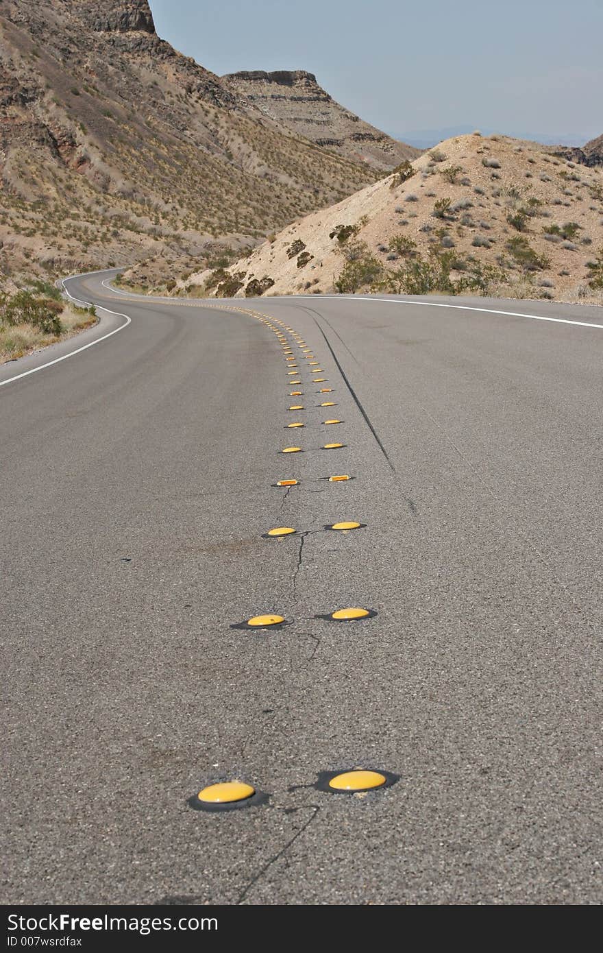 Curvy desert road going nowhere