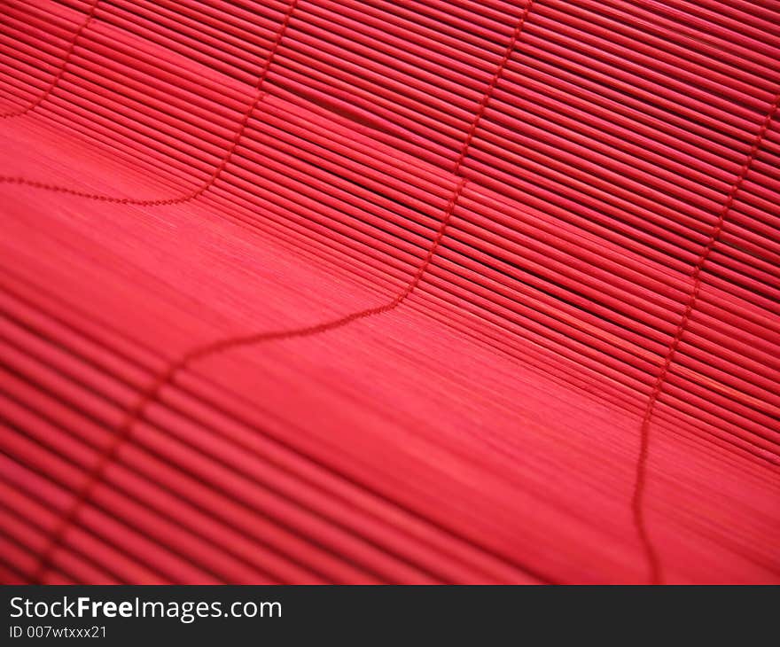 Vivid red bamboo textured background.