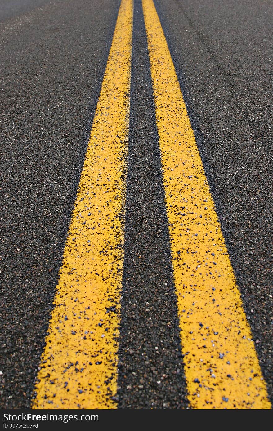 Close up of a two lane desert road