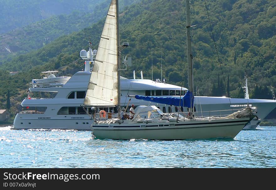 Yacht and boat passing by. Yacht and boat passing by