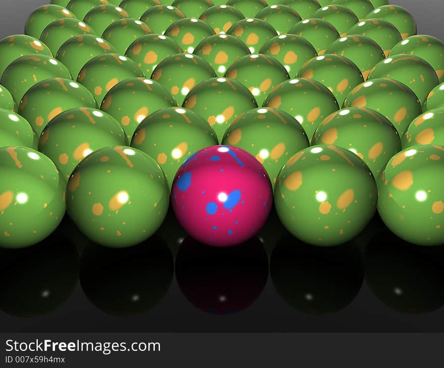 Single bright pink ball in amongst many green balls. Single bright pink ball in amongst many green balls