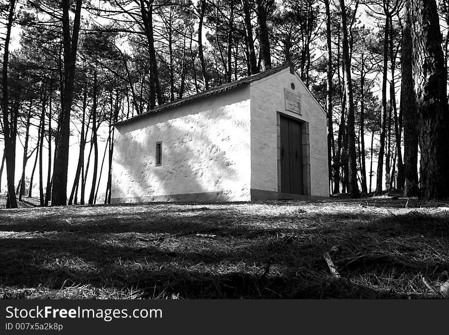 A little old chapel in the middle of the woods.