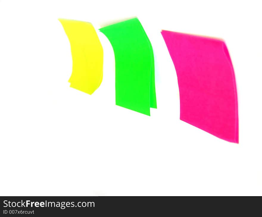 Several post it papers in differet colors. Several post it papers in differet colors