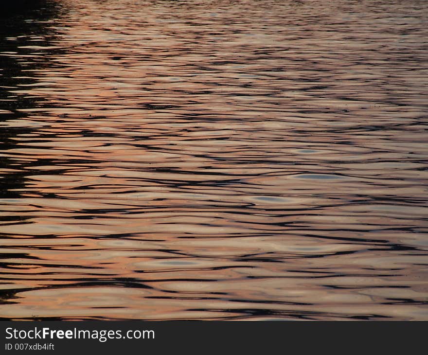 Sunset reflections on the lake surface. Sunset reflections on the lake surface