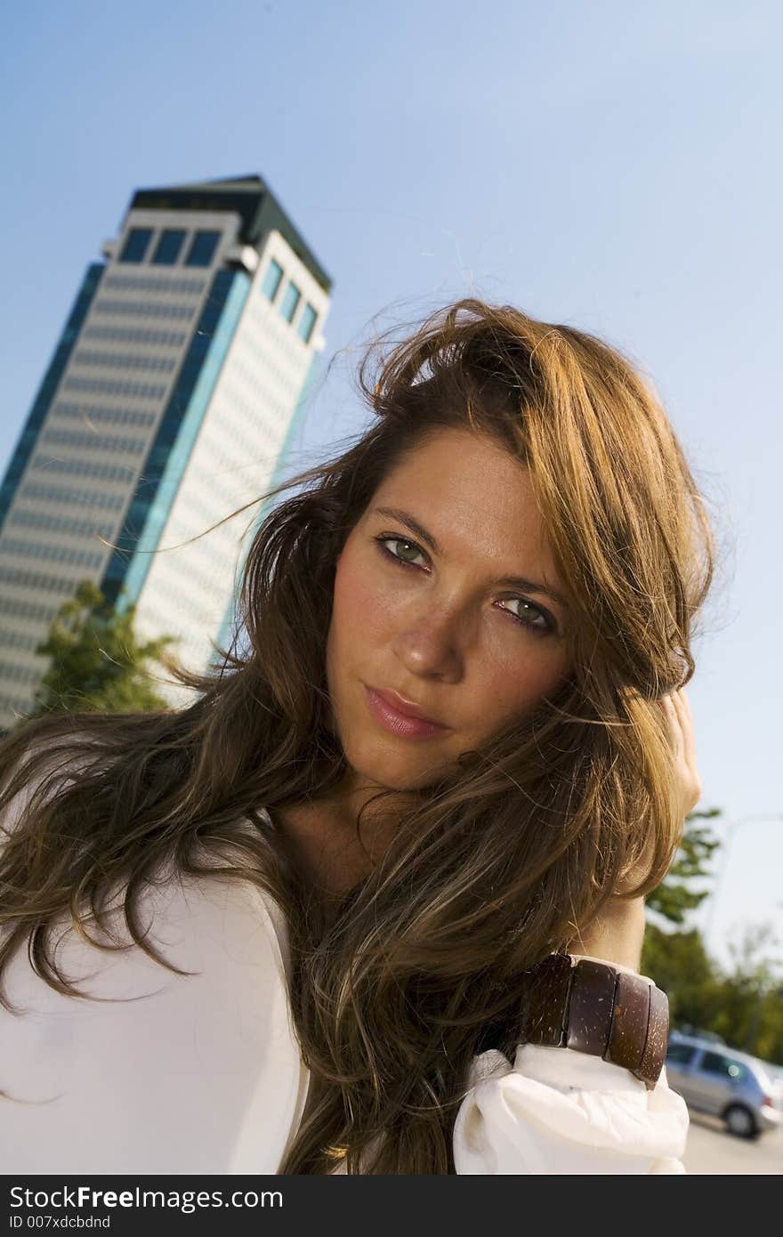 Young businesswoman in front of a building. Young businesswoman in front of a building