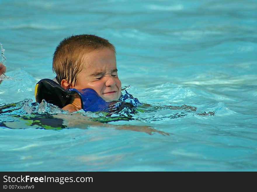 Boy closing eyes in the pool. Boy closing eyes in the pool