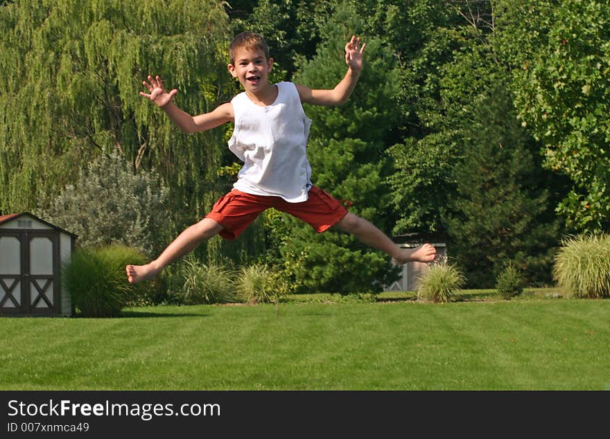 Boy jumping high on trampoline. Boy jumping high on trampoline