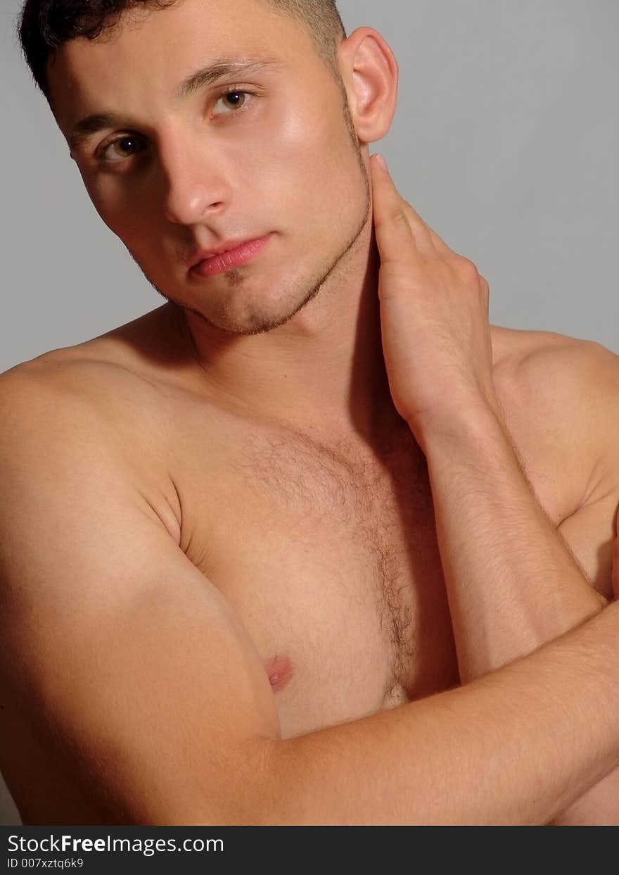 Young man on the gray background